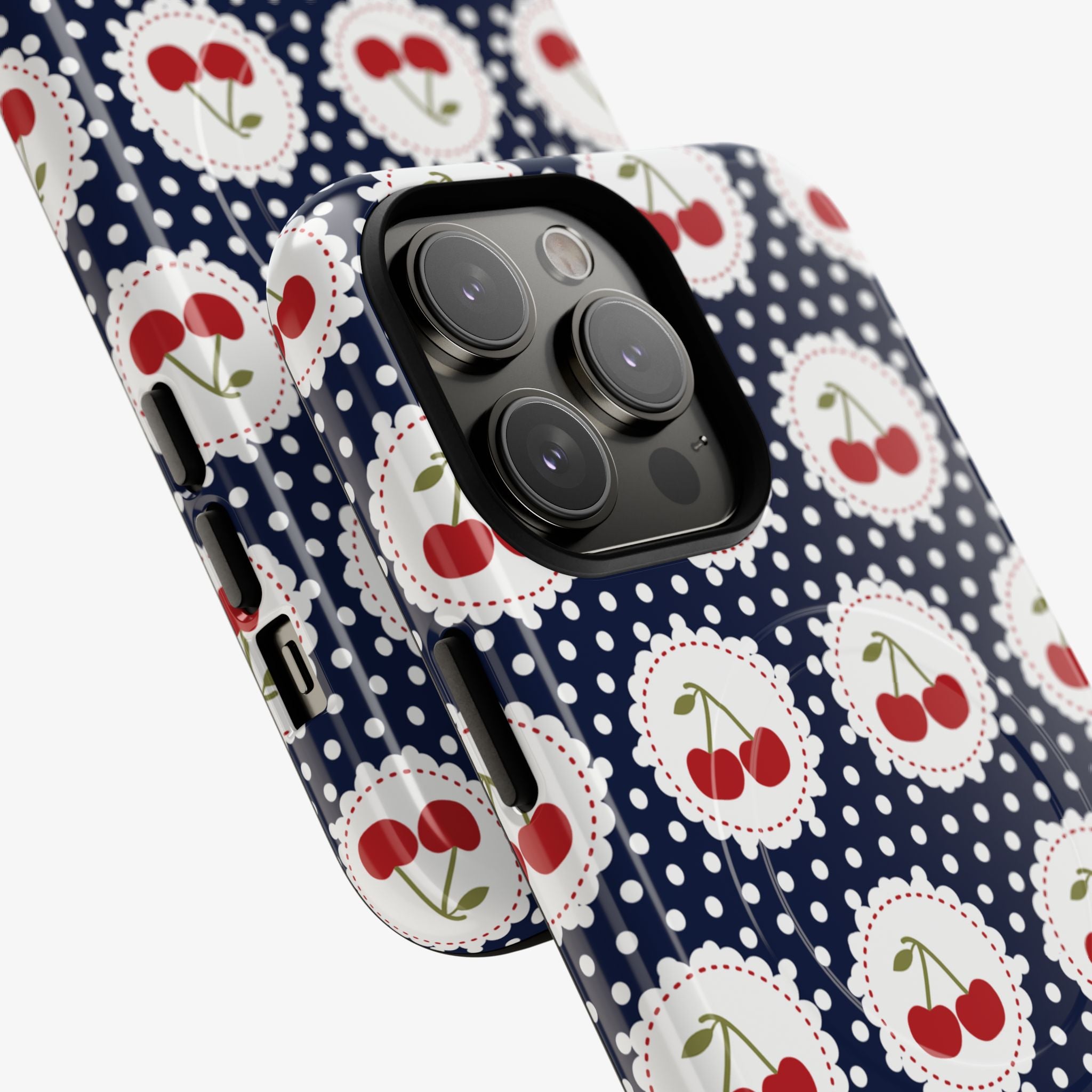 Picnic Preserves (Navy) Signature Series phone case with navy dotted cherry pattern and MagSafe cutout