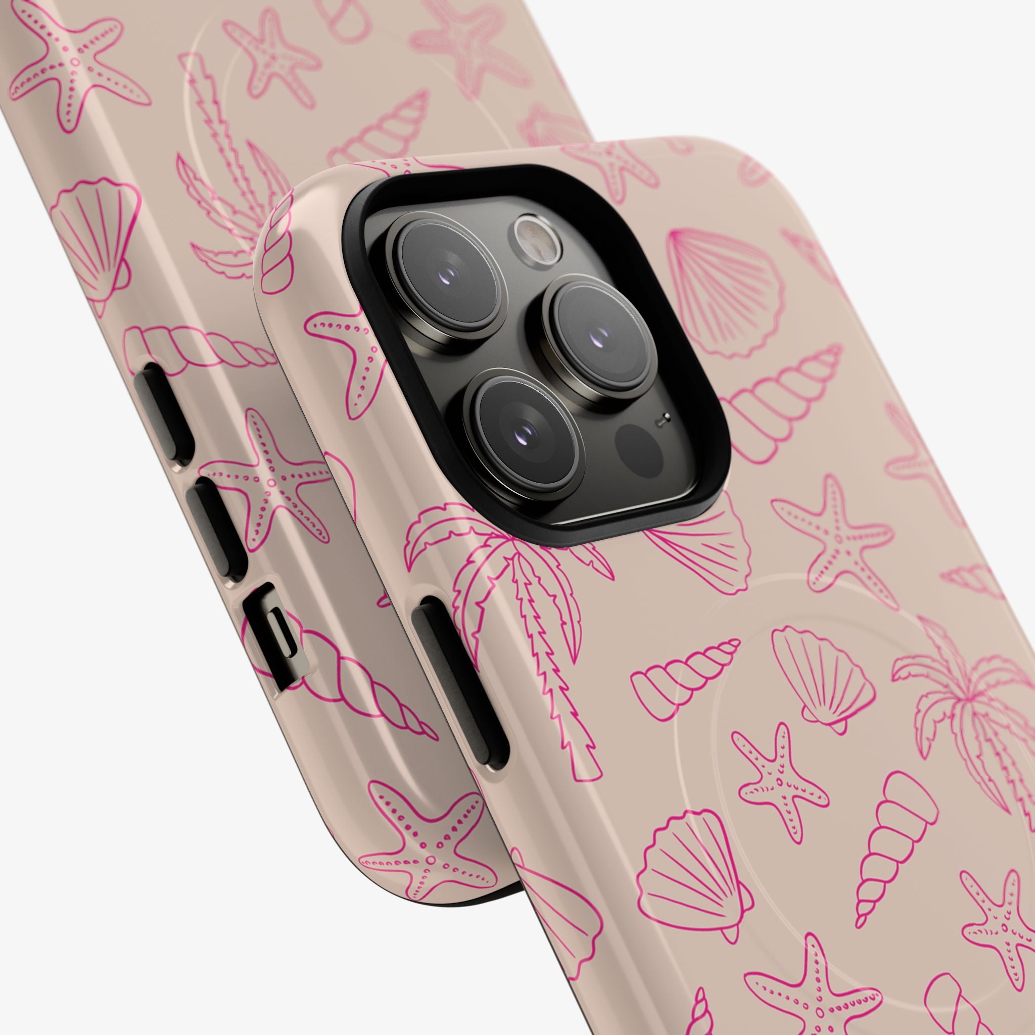 Close-up of a Shoreline | Signature Series Phone Case (MagSafe) featuring a beige background with pink outlined seashells, starfish, and palm tree designs, showcasing its protective and stylish phone case accessories.
