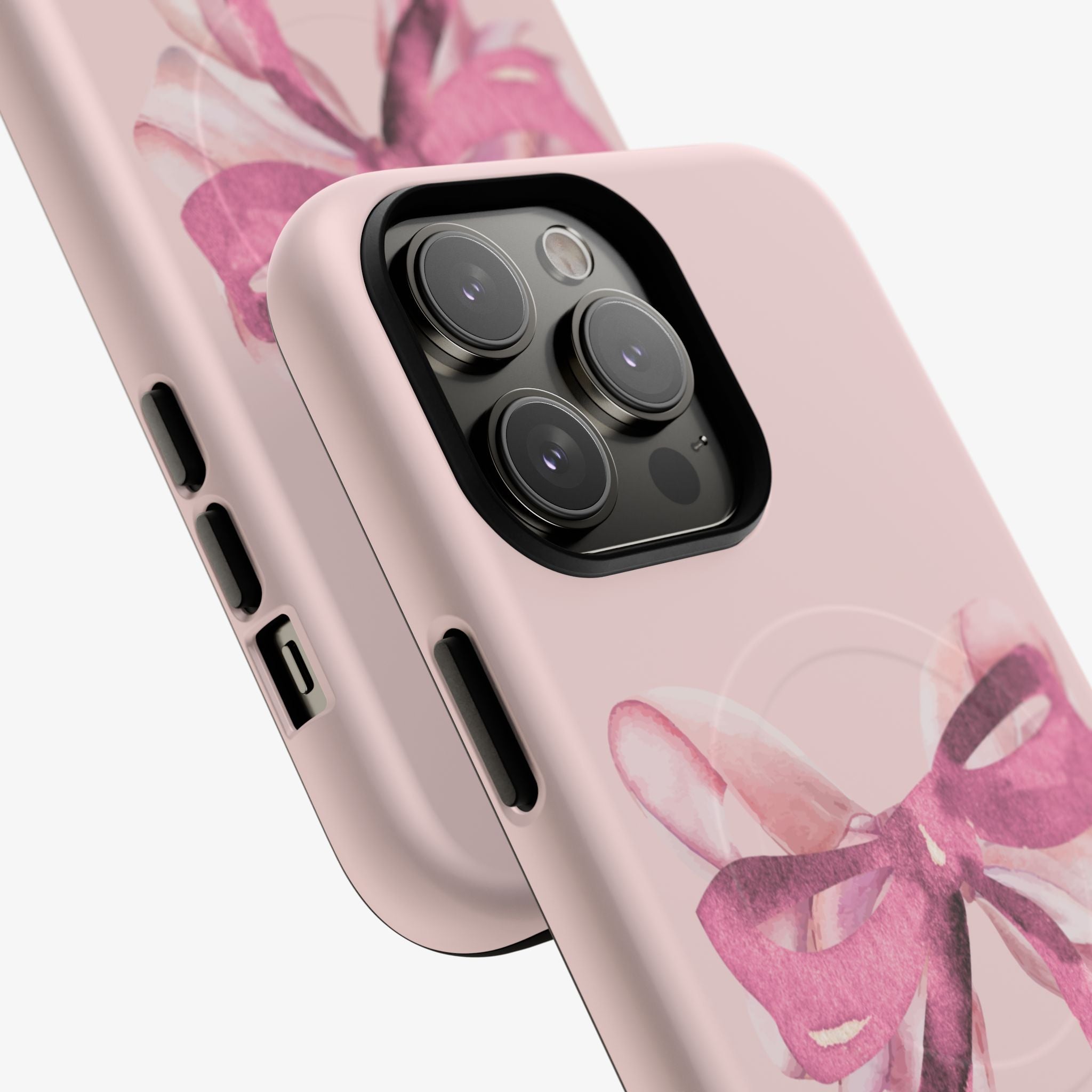 Close-up view of a sleek pink phone case featuring a delicate ballerina ribbon design, showcasing the Ballerina (Pink) | Signature Series Phone Case (MagSafe) model with precision cutouts and smooth finish.